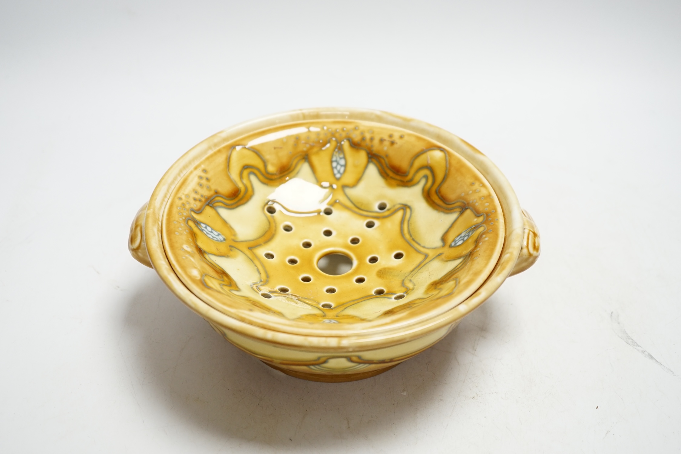 A Mintons Secessionist ware cress strainer dish, 21cm diameter